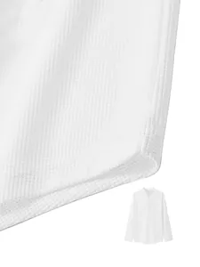 Close-up detail of white waffle knit fabric on men's long-sleeve shirt.