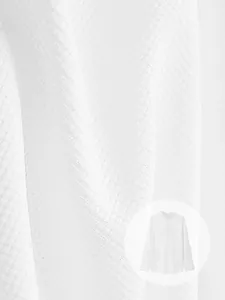 Close-up macro detail of premium white waffle knit fabric texture for men's shirt
