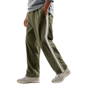 Detailed side profile of olive green men's corduroy pants featuring sport side stripes
