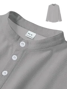 Close-up of grey waffle knit long-sleeve Polo shirt with buttons and neck label.