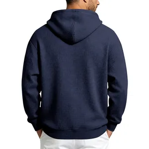Back view of navy blue waffle-knit hoodie for men with clean white background