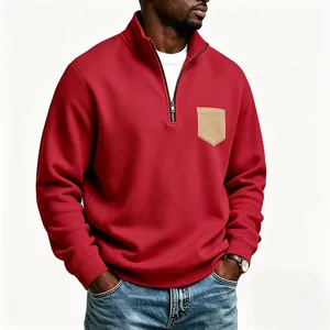 Detail view of men's red half-zip sweatshirt with khaki pocket and fleece lining.
