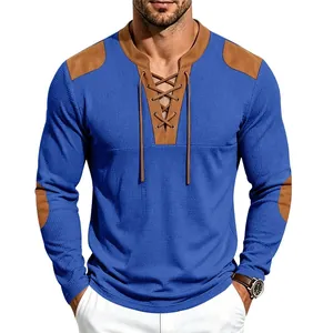 Close-up of men's blue waffle knit Henley shirt with brown patchwork and lace-up neck