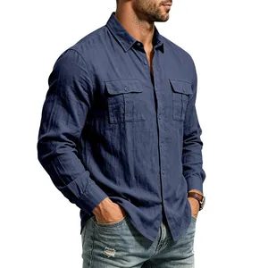 Detail shot of men's navy blue linen shirt with dual chest pockets and button closure.