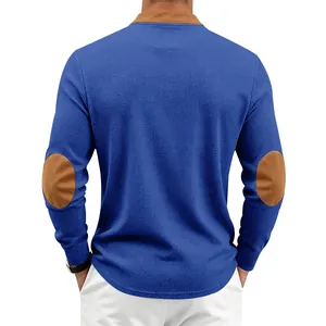 Detail view of men's blue waffle knit henley shirt featuring brown elbow patches