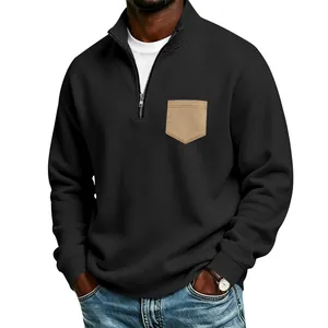 Detailed view of men's black half-zip sweatshirt with a stylish khaki chest pocket.