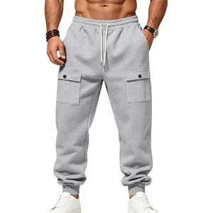 Close-up of men's grey fleece cargo joggers featuring drawstring waist and snap pockets