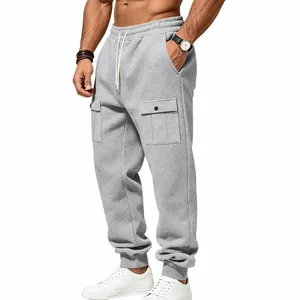 Close-up detail of grey men's cargo sweatpants featuring drawstring waist and large pockets.