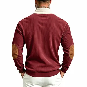 Detail view of men's burgundy corduroy sweatshirt with contrast collar and elbow patches