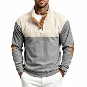 Detail of men's color-block corduroy sweatshirt with stand collar and elbow patches