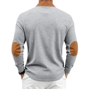 Back view of men's gray waffle knit Henley shirt featuring brown suede elbow patches