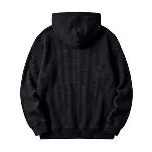 Back view of a black men's waffle knit hoodie showing high-quality textured fabric.