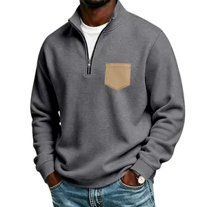 Close-up of men's half-zip fleece sweatshirt with contrast chest pocket detail