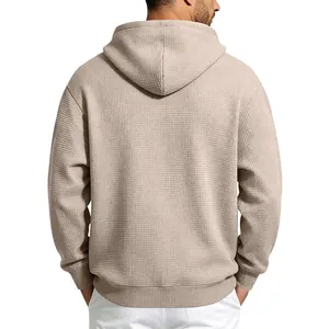 Back view of a beige men's waffle knit hoodie showing soft textured fabric details