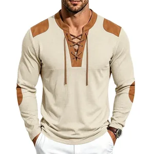 Detail of men's waffle knit Henley shirt with lace-up neck and contrast shoulder patches.