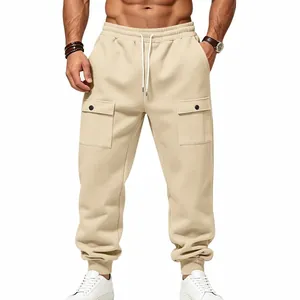 Detailed view of men's beige fleece cargo sweatpants with drawstring and pockets