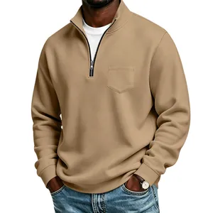Detailed look at men's tan half-zip fleece sweatshirt with stand collar and pocket.
