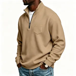 Detailed side profile of a men's khaki half-zip sweatshirt featuring a functional chest pocket