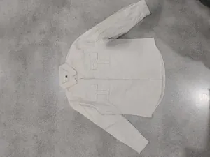 Detailed flat lay of men's linen long-sleeve work shirt with double chest pockets
