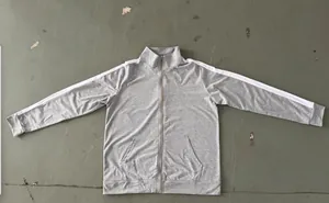 Detailed view of grey men's zip-up track jacket with contrast white shoulder stripes
