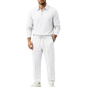 Professional detail shot of white cotton linen long sleeve casual polo and pants set