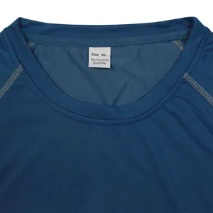 Close-up of neckline and size tag on men's blue athletic compression t-shirt