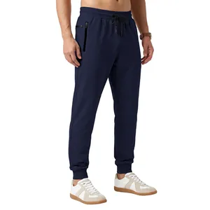 Detailed view of men's navy blue joggers with drawstring waist and zip side pockets