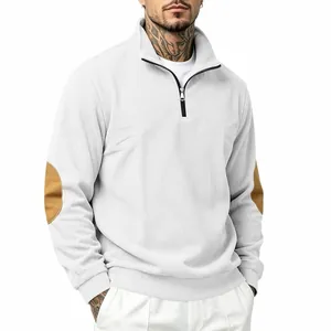 Detail view of men's white corduroy half-zip sweatshirt with brown elbow patches