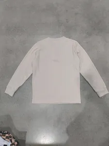 Detailed view of the back of a men's long-sleeve T-shirt with vertical rib texture
