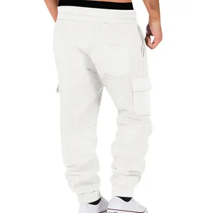 Rear detail view of white waffle knit cargo joggers for men showing fabric texture