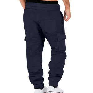 Back view of navy waffle-knit cargo joggers for men with pocket details