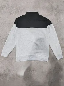 Back view of men's color-block sweatshirt with quilted shoulder and stand collar details