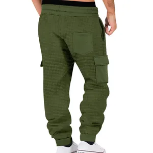 Detailed back view of olive green waffle knit cargo joggers with multi-pockets