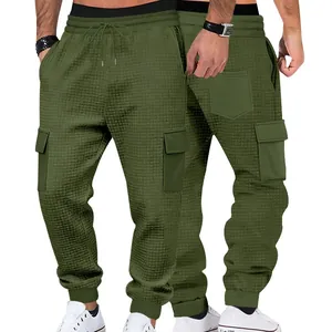 Detailed view of olive green waffle knit cargo joggers with multiple pockets for men.