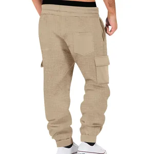 Back view of men's khaki waffle-knit cargo joggers showing waffle texture and pockets