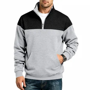 Detail view of men's heavy color-block sweatshirt with black quilted shoulder panels.