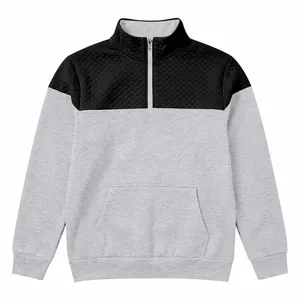 Detail view of men's quarter-zip sweatshirt with quilted chest panel and gray body
