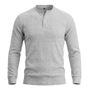 Close-up of men's grey long-sleeved Henley shirt featuring vertical cable-knit texture.