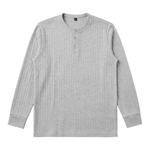 Detailed macro view of a gray ribbed long-sleeve Henley shirt with button placket