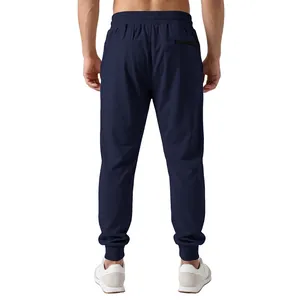 Detailed back view of navy blue men's jogger pants featuring an elastic waist and cuffed hem