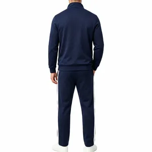 Back view of a navy blue men's tracksuit featuring white side stripes and a stand collar