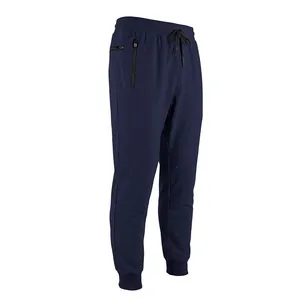 Detail view of navy blue men's joggers featuring drawstring waist and zipper pockets