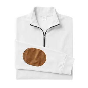 Detailed view of a white ribbed half-zip sweatshirt featuring a stylish brown elbow patch