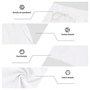 Detail view of white cotton linen pants showing waistband, pocket, and fabric texture