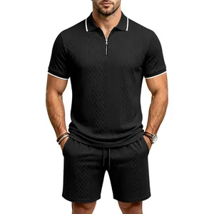 Close-up of men's black polo set with diamond jacquard texture and half-zip collar
