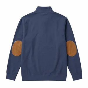 Detailed back view of blue ribbed sweatshirt featuring brown suede elbow patches