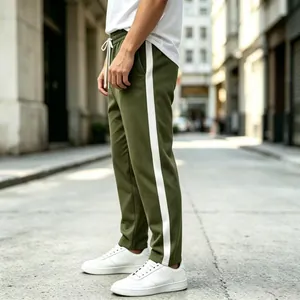 Detail view of men's olive green sweatpants with white side stripes and drawstring waist