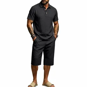 Detailed view of men's charcoal grey cotton linen polo shirt and striped shorts set