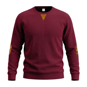 Detail van bordeaux corduroy sweatshirt met contrasterende hals en elleboogstukken