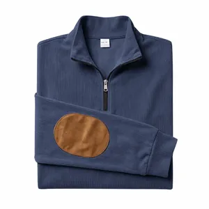 Detail view of navy blue ribbed half-zip sweatshirt with brown elbow patches.